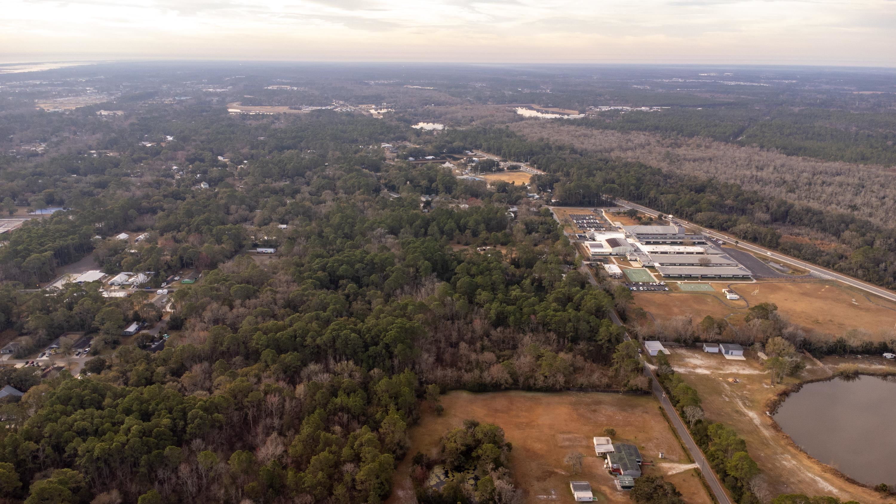0 North Clay Street St. Augustine, FL 32084 - Photo 8 of 21 View of property location with a heavily wooded area and a large body of water