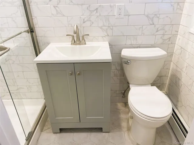 a bathroom with a toilet and a sink