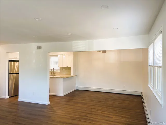 a view of a kitchen with a sink and a window