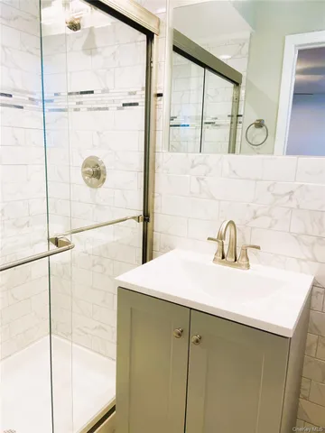 a bathroom with a sink and a shower