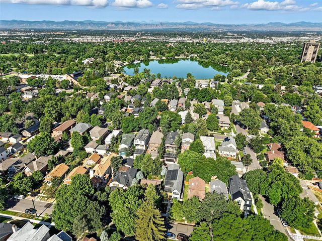 an aerial view of a houses with a yard
