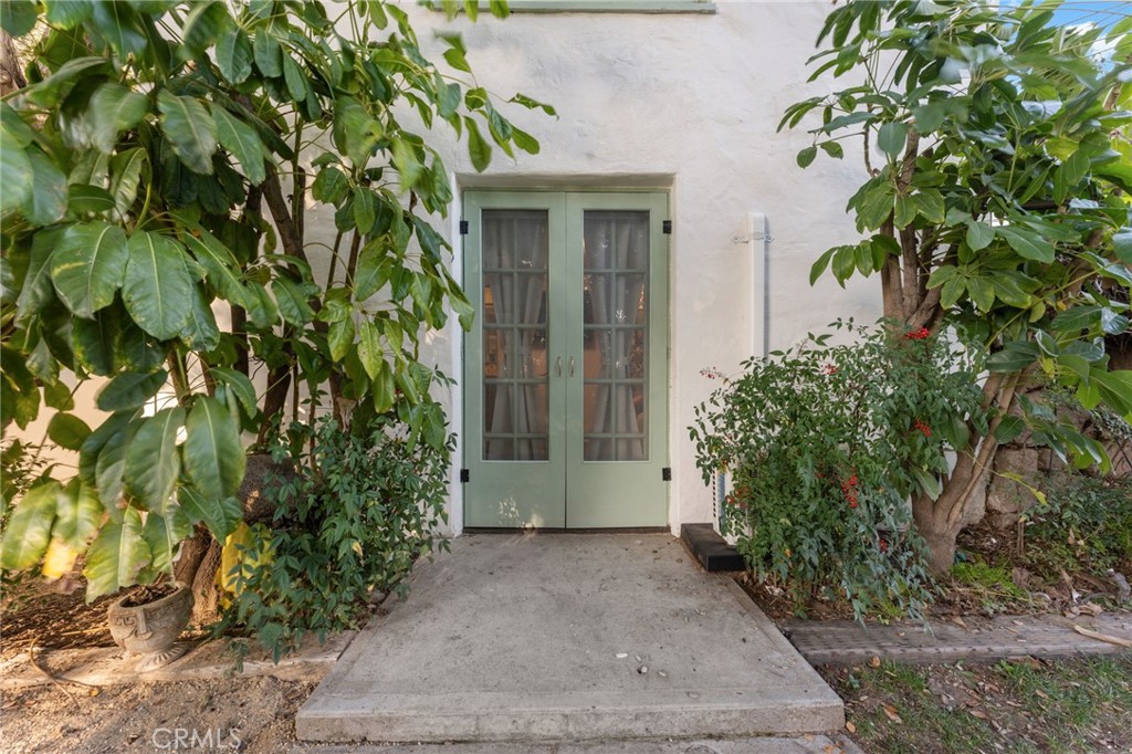 4855 Glenwood Drive Riverside, CA 92501 - Photo 18 of 39 a front view of a house with a garden
