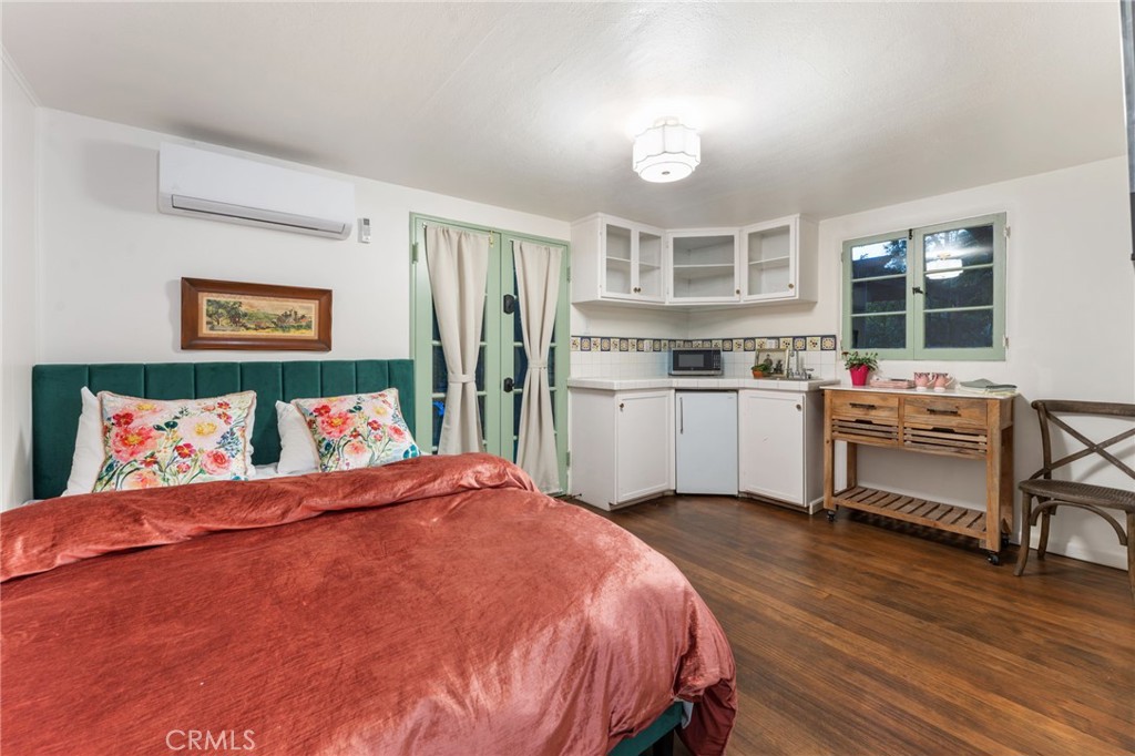 4855 Glenwood Drive Riverside, CA 92501 - Photo 20 of 39 a bed room with a bed and a chair