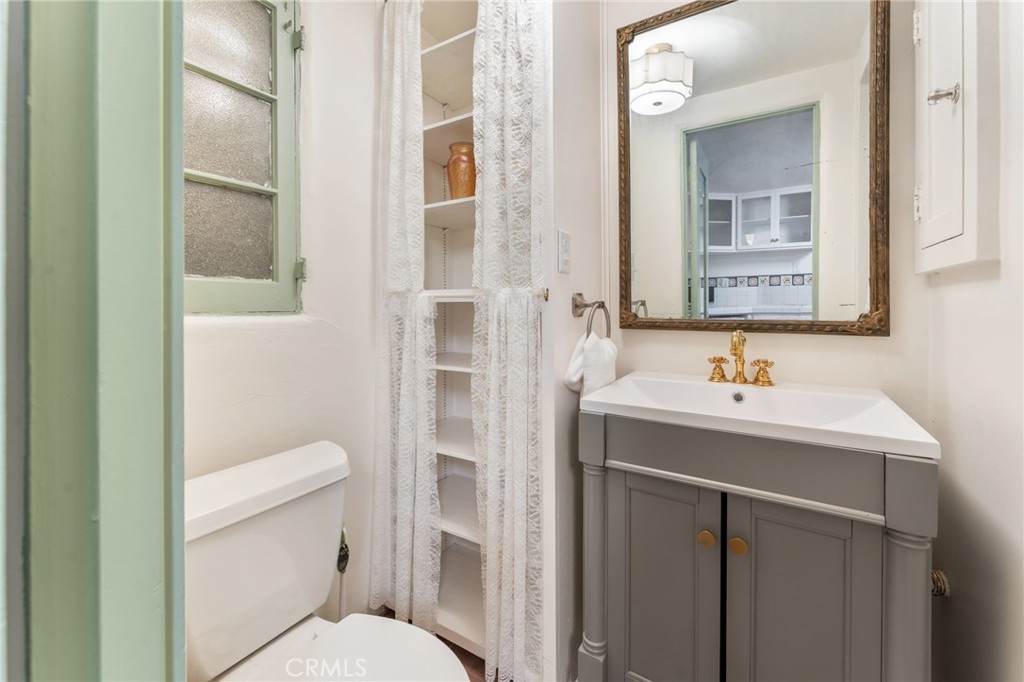 4855 Glenwood Drive Riverside, CA 92501 - Photo 21 of 39 a bathroom with a sink toilet and shower