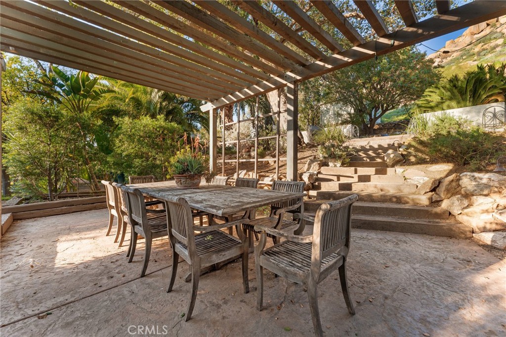 4855 Glenwood Drive Riverside, CA 92501 - Photo 26 of 39 a patio with table and chairs and potted plants