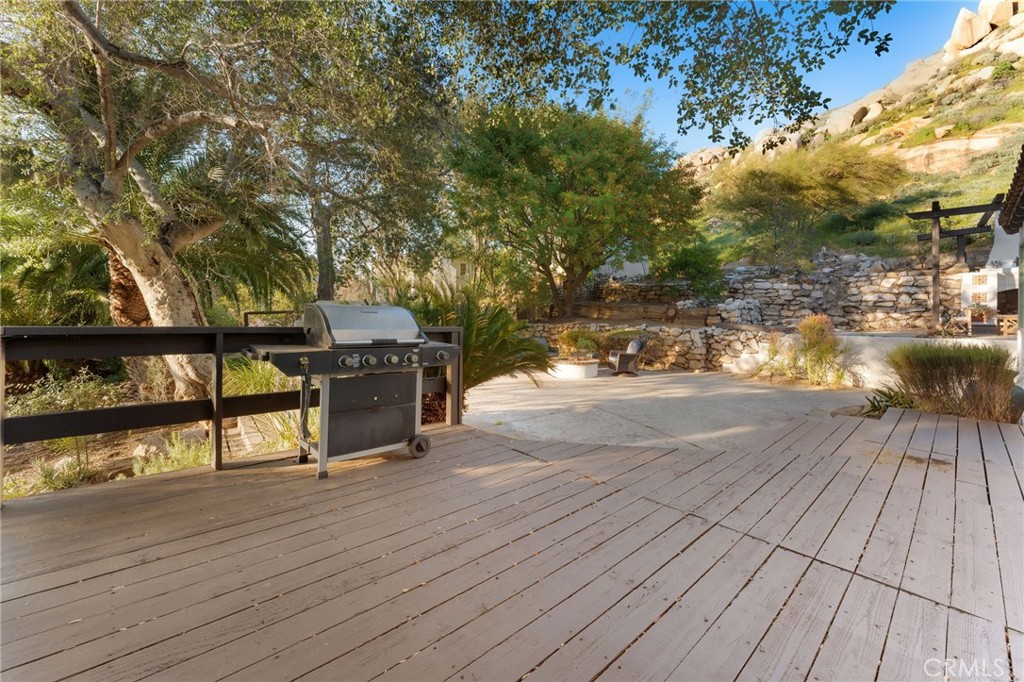 4855 Glenwood Drive Riverside, CA 92501 - Photo 28 of 39 a view of outdoor space with deck and large trees