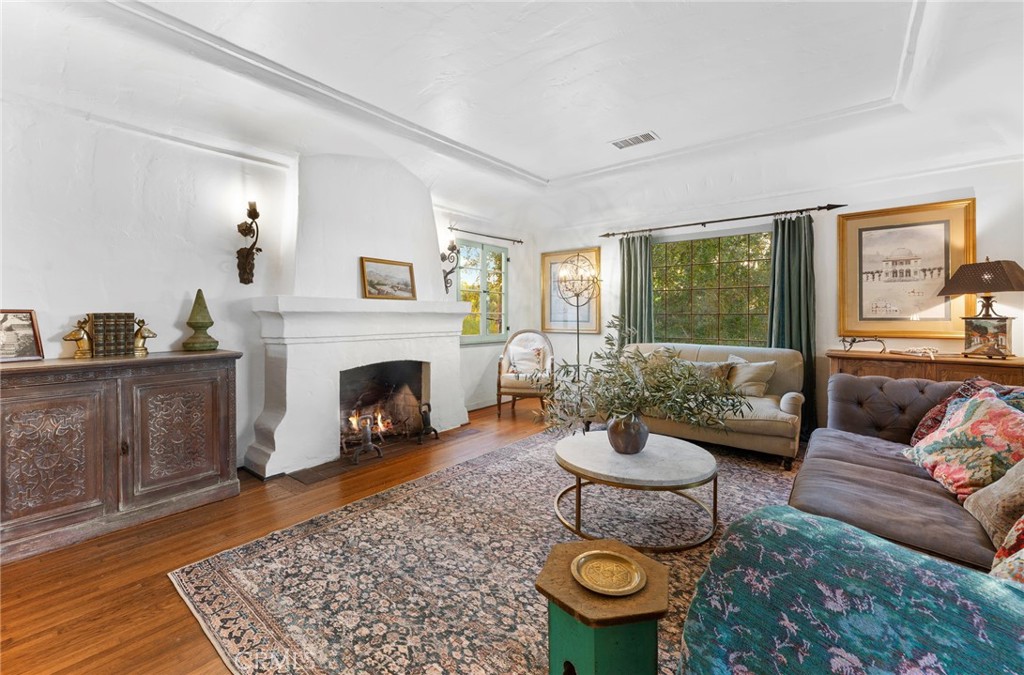 4855 Glenwood Drive Riverside, CA 92501 - Photo 10 of 39 a living room with furniture and a fireplace