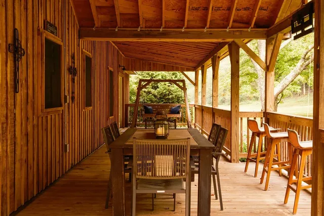 a dining room with furniture window and outside view