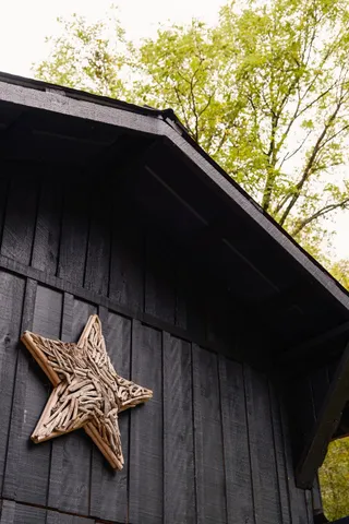 a view of a lake with a table and chairs under an umbrella