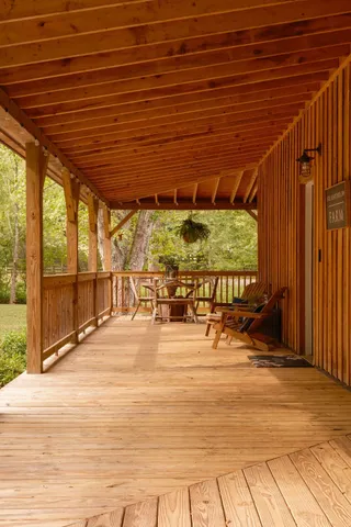 a view of a chairs and table in the balcony