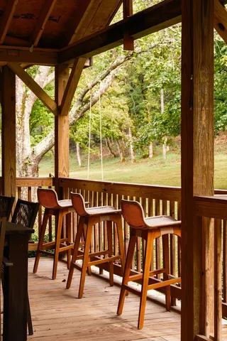 a view of a porch with wooden floor and outdoor space