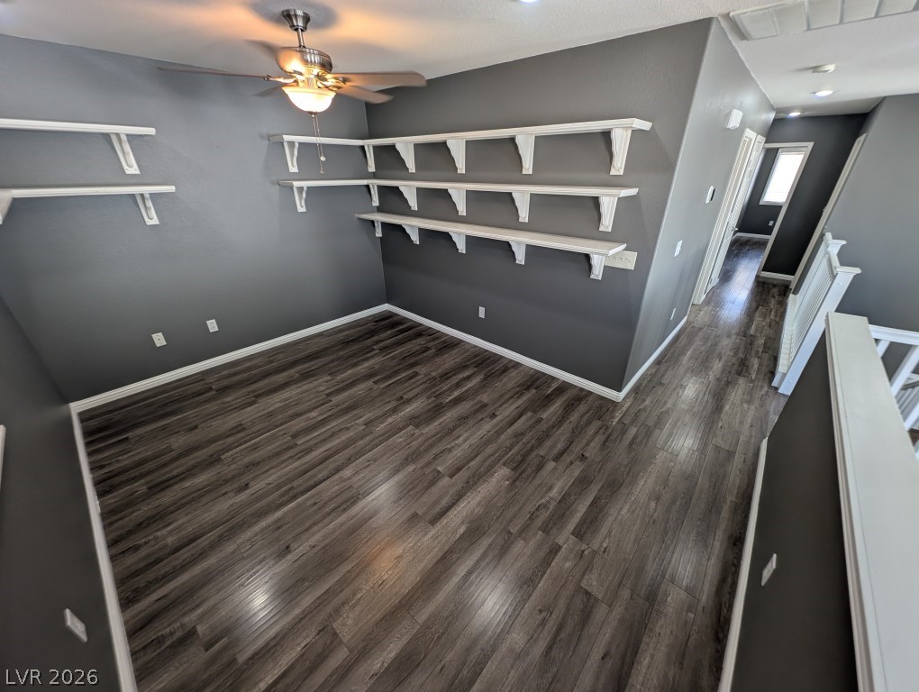 9121 Spoonbill Ridge Place Las Vegas, NV 89143 - Photo 10 of 26 Well-lit room features ample shelving and attractive wood flooring.