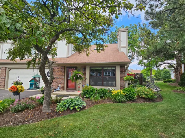 a large kitchen with stainless steel appliances granite countertop a stove and a wooden floors