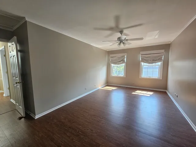 a bathroom with a granite countertop toilet sink and mirror