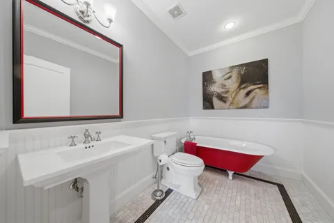 a bathroom with a granite countertop sink a mirror and shower