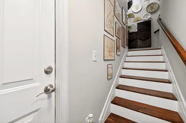 a view of staircase with white walls