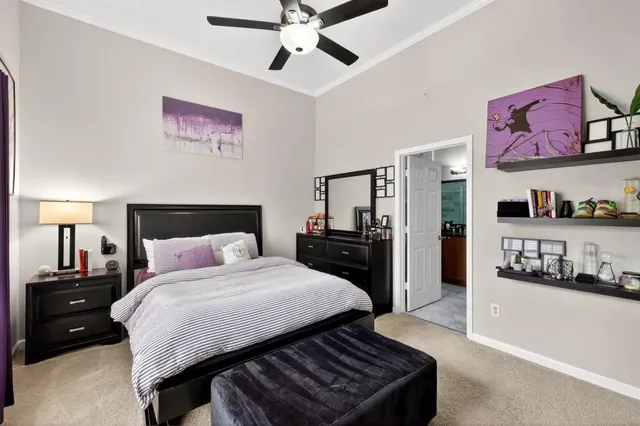 a bedroom with a bed and a walk in closet