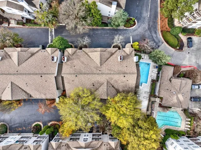 an aerial view of a house with a yard