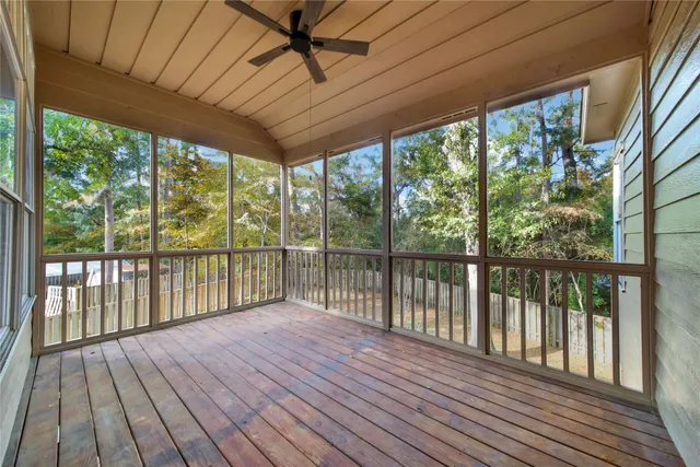 a view of a balcony with wooden floor