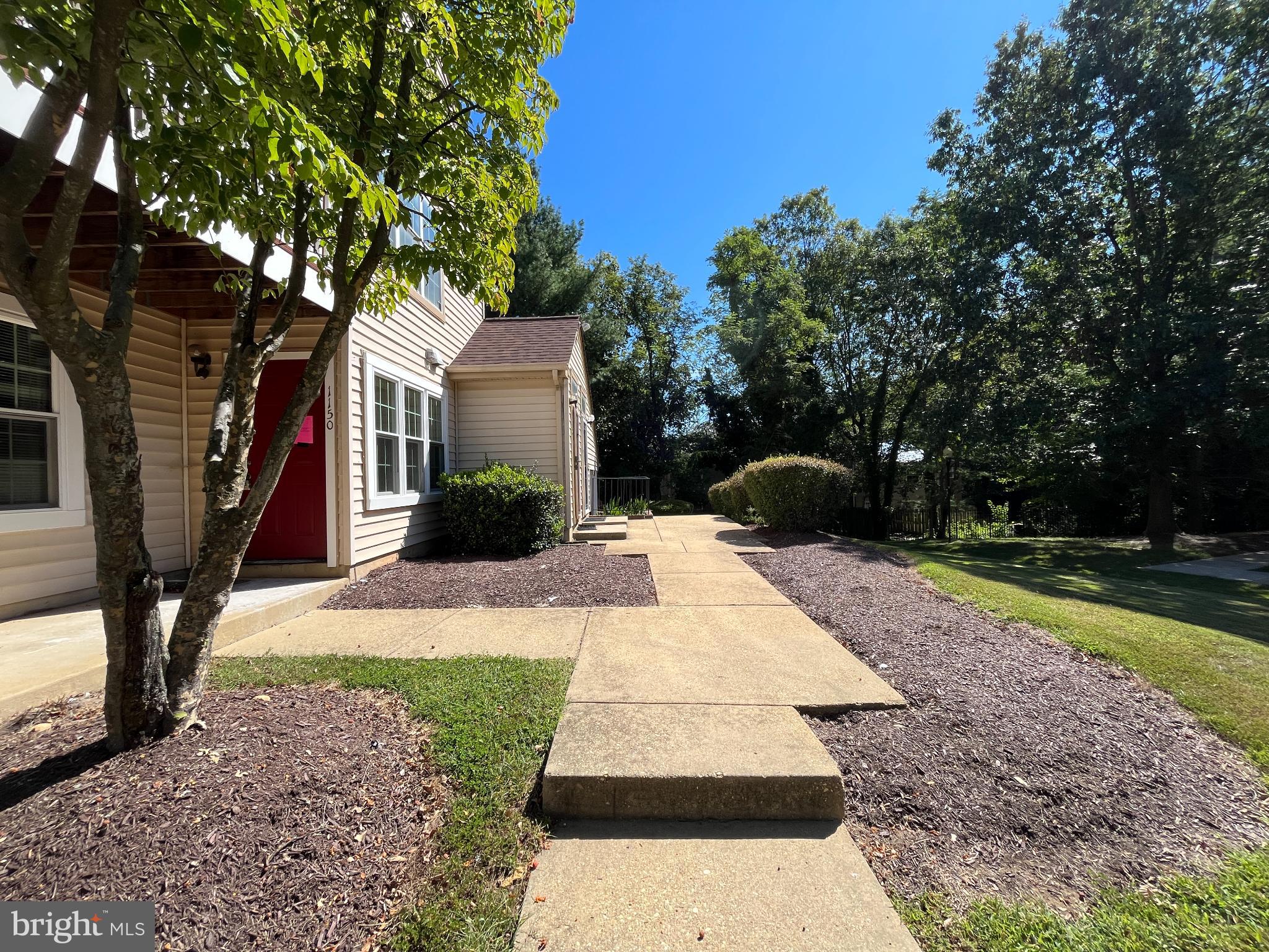 1152 Windemere Court Fort Washington, MD 20744 - Photo 3 of 22 a front view of a house with garden