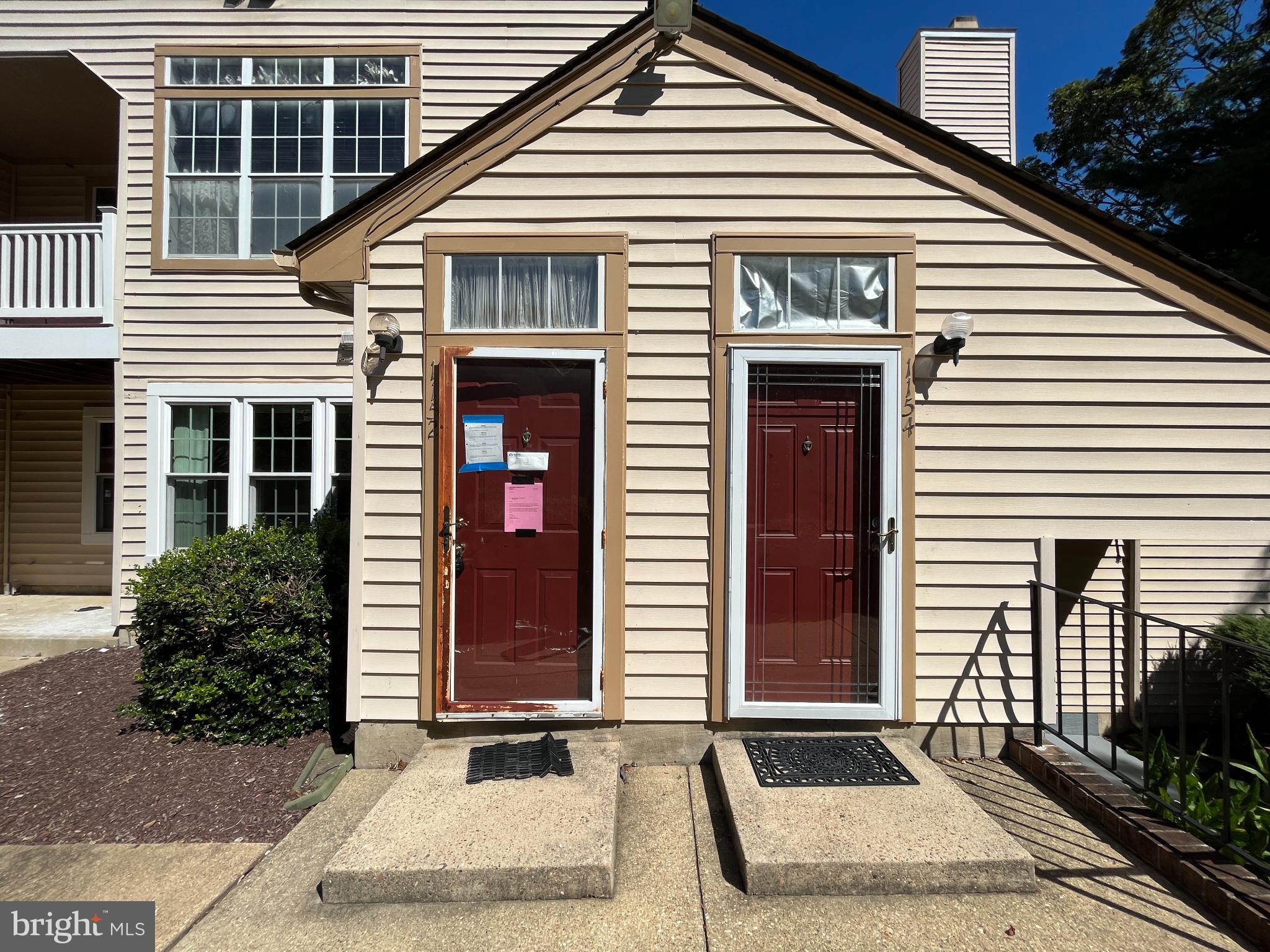 1152 Windemere Court Fort Washington, MD 20744 - Photo 6 of 22 a front view of a house with a yard