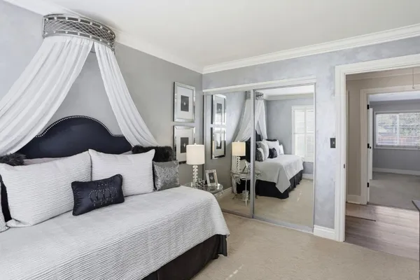 a bedroom with a bed and a couch