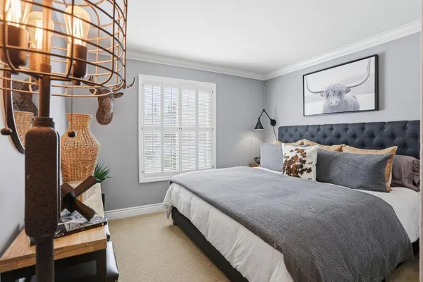 a bed room with a bed and a window