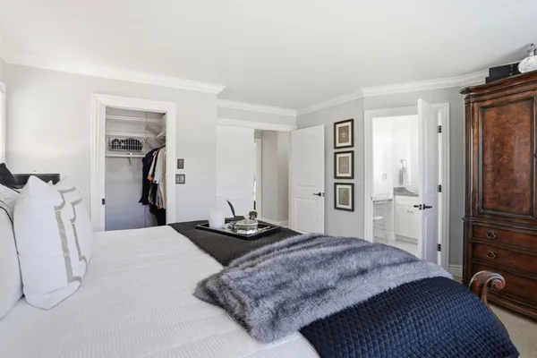 a bedroom with a bed and a cabinets