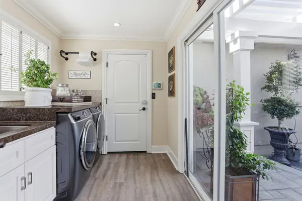 a kitchen with a sink and a refrigerator