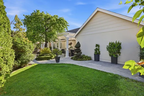 a front view of a house with a garden and porch