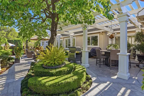 a view of a chairs and table in a patio