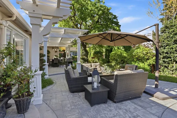 a view of a patio with couches and potted plants