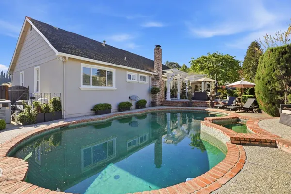 a view of a swimming pool with a patio