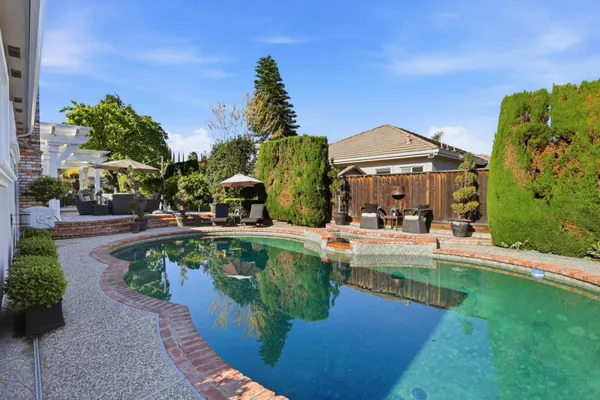 a view of a swimming pool with a patio