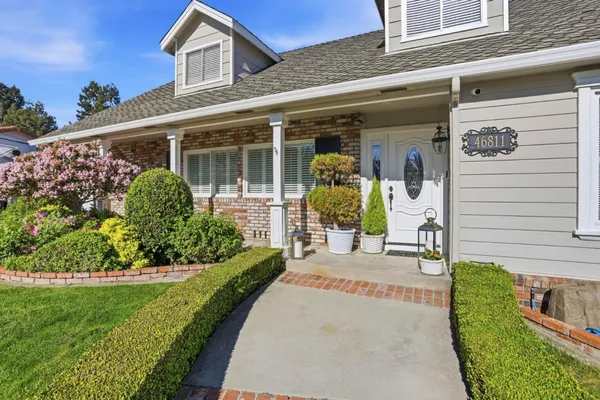 a front view of a house with a porch