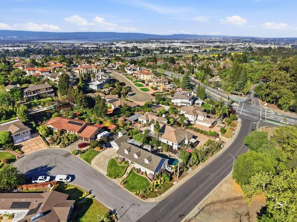 an aerial view of a houses with yard