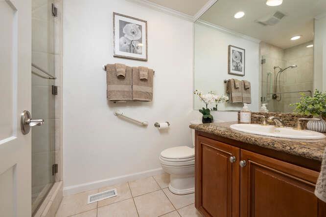 906 Bluebell Way Sunnyvale, CA 94086 - Photo 15 of 27 a bathroom with a granite countertop sink mirror vanity and toilet