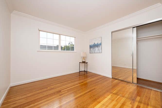 906 Bluebell Way Sunnyvale, CA 94086 - Photo 19 of 27 an empty room with wooden floor and windows