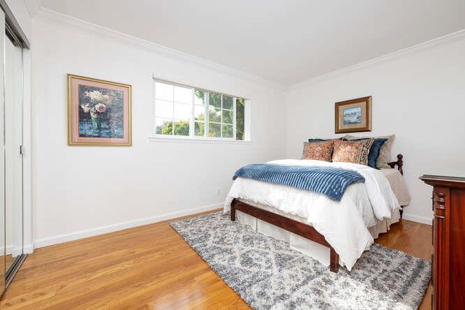 906 Bluebell Way Sunnyvale, CA 94086 - Photo 20 of 27 a bedroom with a bed and a wall painting