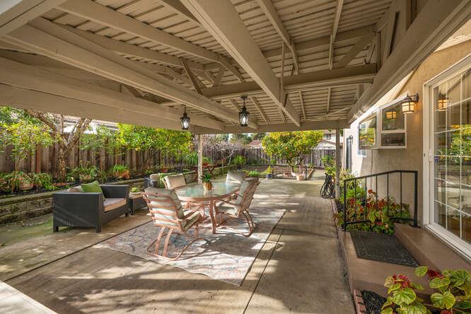 906 Bluebell Way Sunnyvale, CA 94086 - Photo 25 of 27 a view of a patio with a dining table and chairs with a barbeque grill