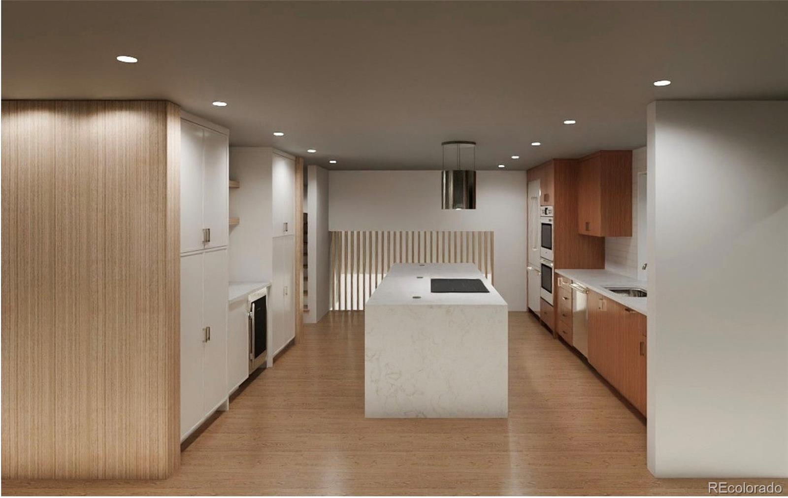 3072 Mountain Shadows Drive Wheat Ridge, CO 80215 - Photo 3 of 10 a large kitchen with stainless steel appliances a large counter top a oven and a sink