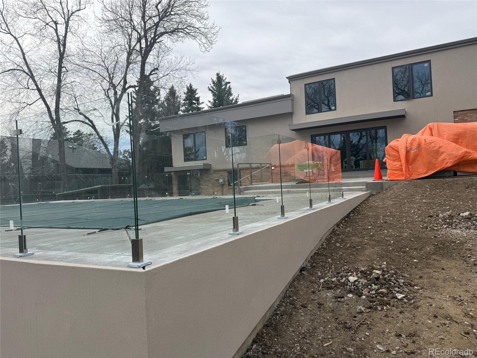 3072 Mountain Shadows Drive Wheat Ridge, CO 80215 - Photo 5 of 10 a view of a house with a patio