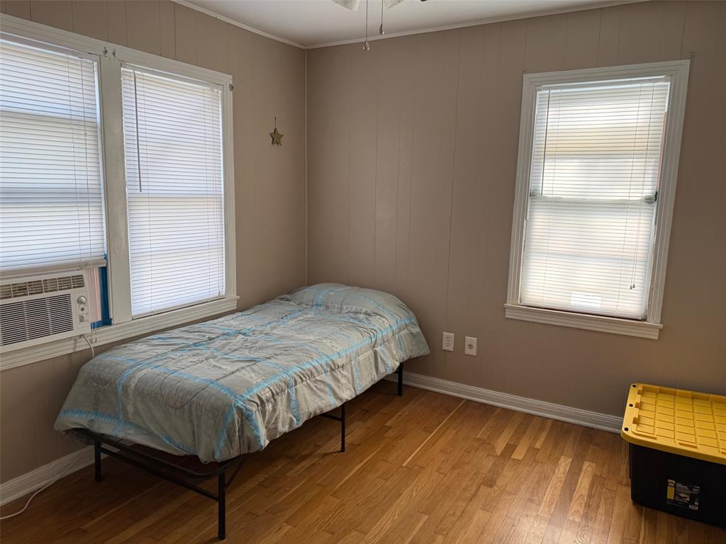 1716 Sheppard Street Waco, TX 76711 - Photo 6 of 13 a bedroom with a bed and a window