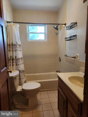 a view of a patio with table and chairs with wooden fence and plants