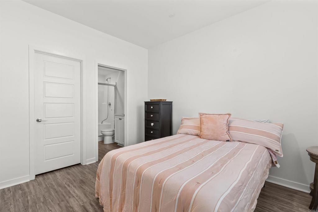 29809 Gypsy Vanner Way Menifee, CA 92584 - Photo 9 of 45 a bedroom with a bed and wooden floor