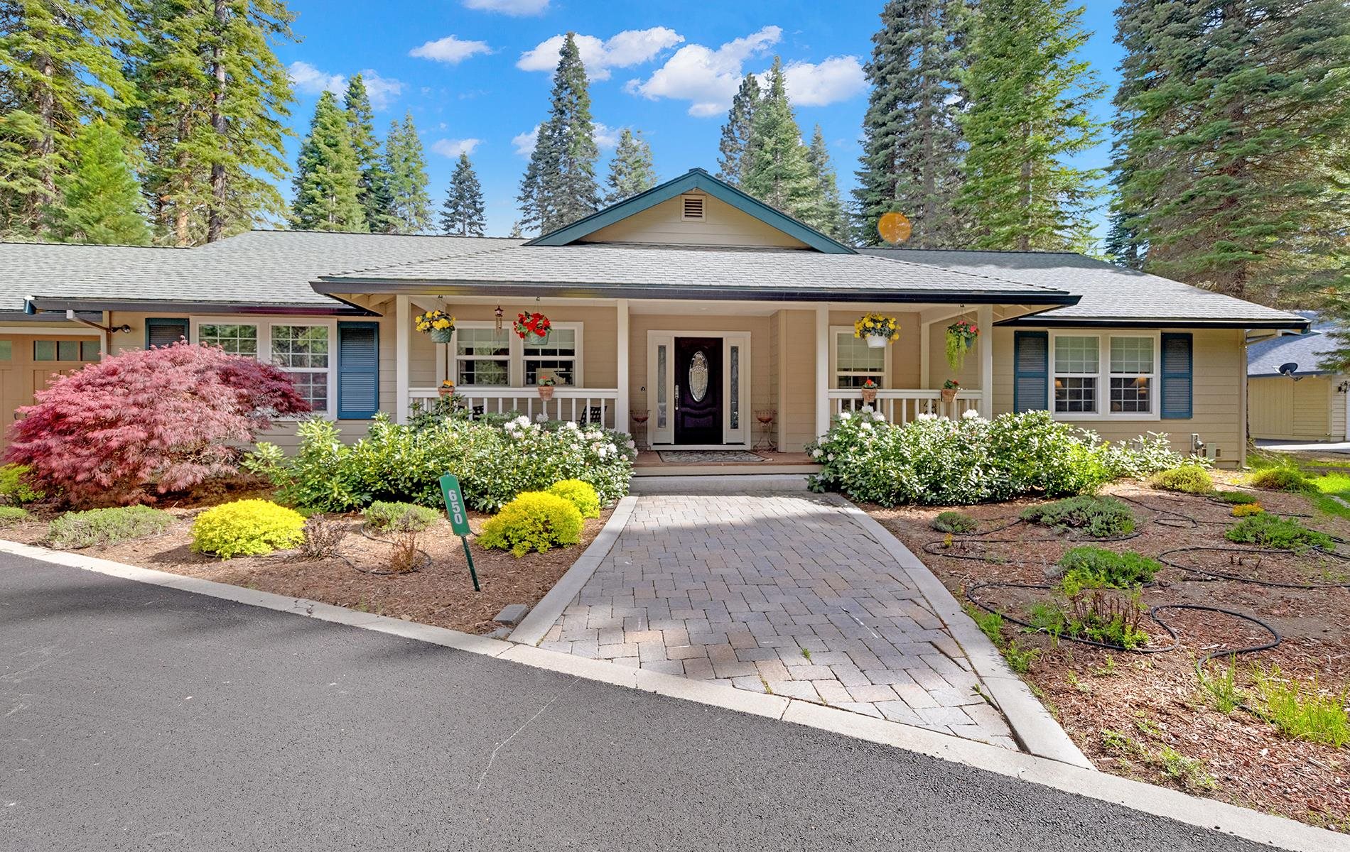 650 Wagon Road Chester, CA 96020 - Photo 33 of 36 a front view of a house with garden