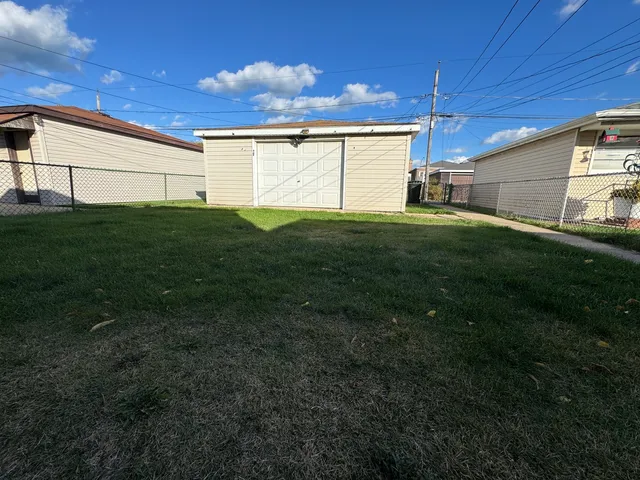 a view of a backyard with potted plants