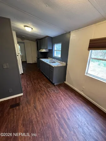 a utility room with cabinets washer and dryer