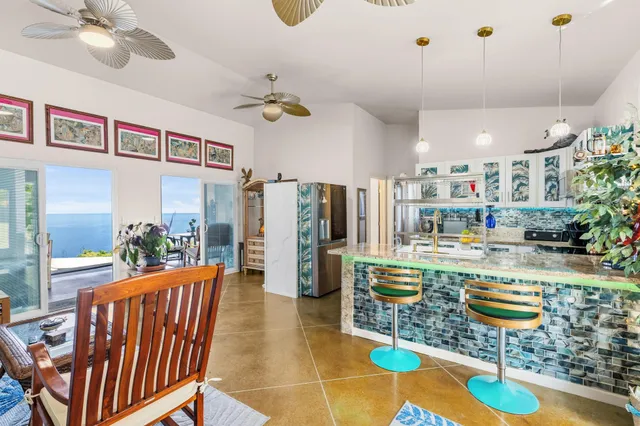 a living room with lots of furniture and a chandelier