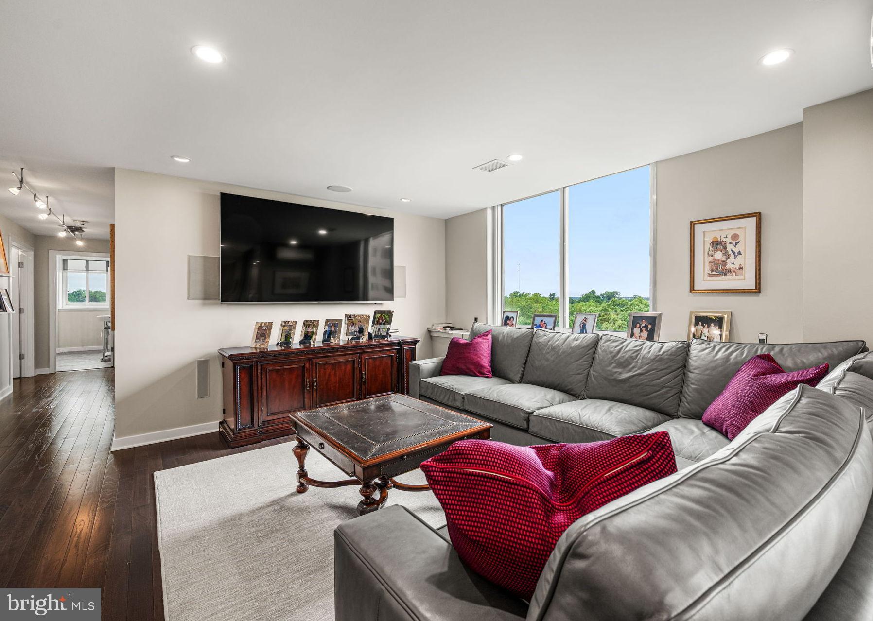 191 Presidential Boulevard, Unit R828 Bala Cynwyd, PA 19004 - Photo 16 of 50 a living room with furniture and a flat screen tv